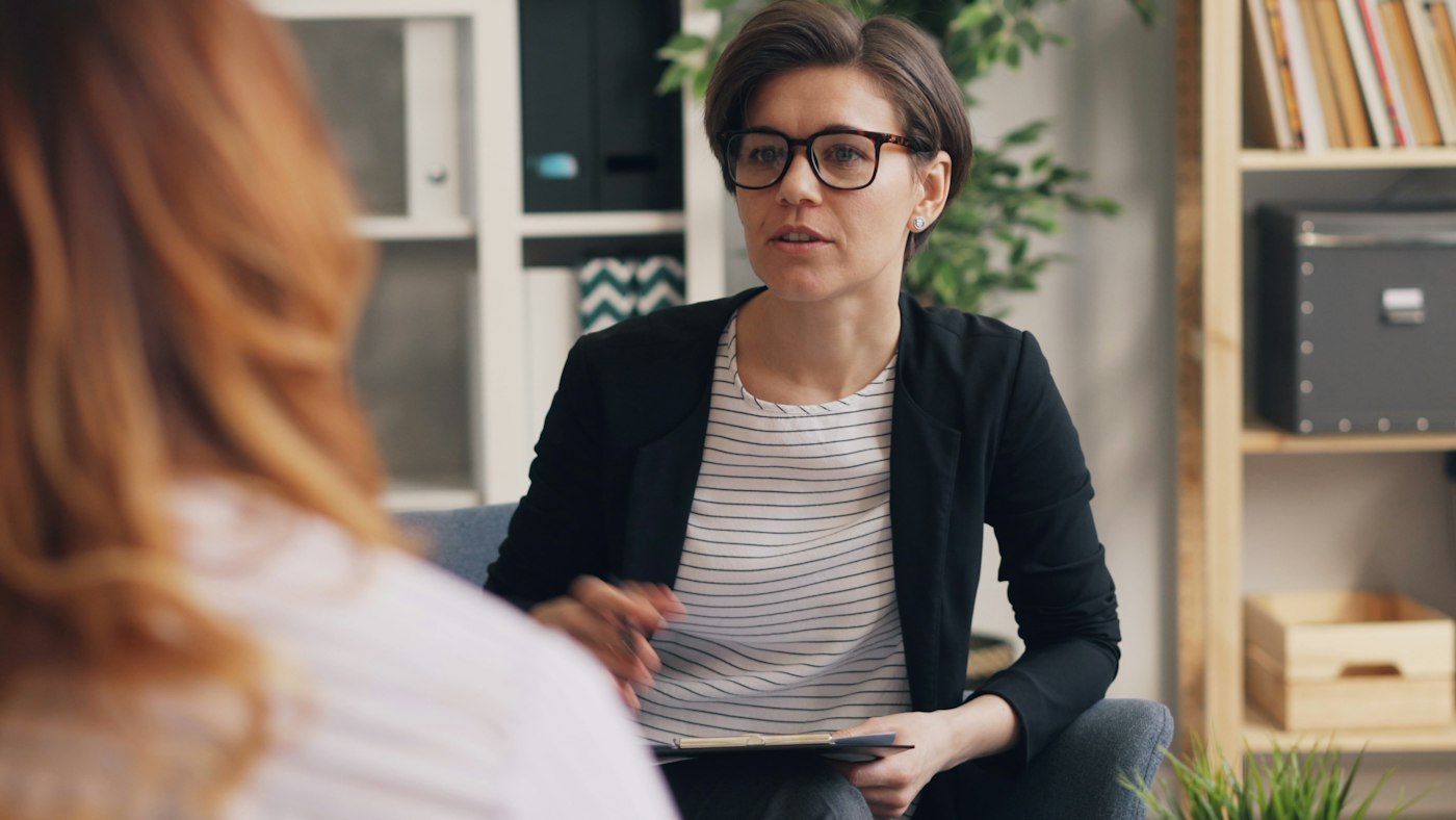 A woman listening in conversation